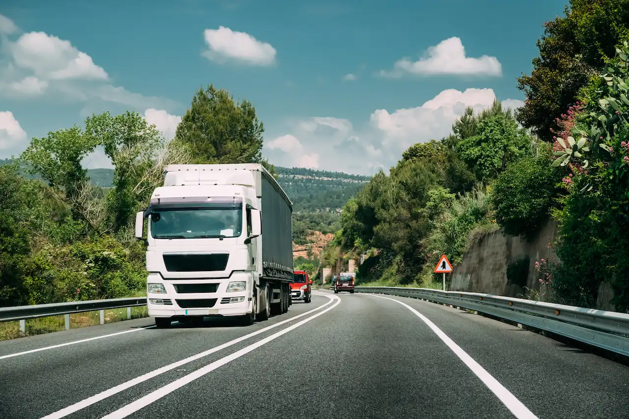 truck transporting goods on rural roadway 2026 09 23 23 43 31 utc