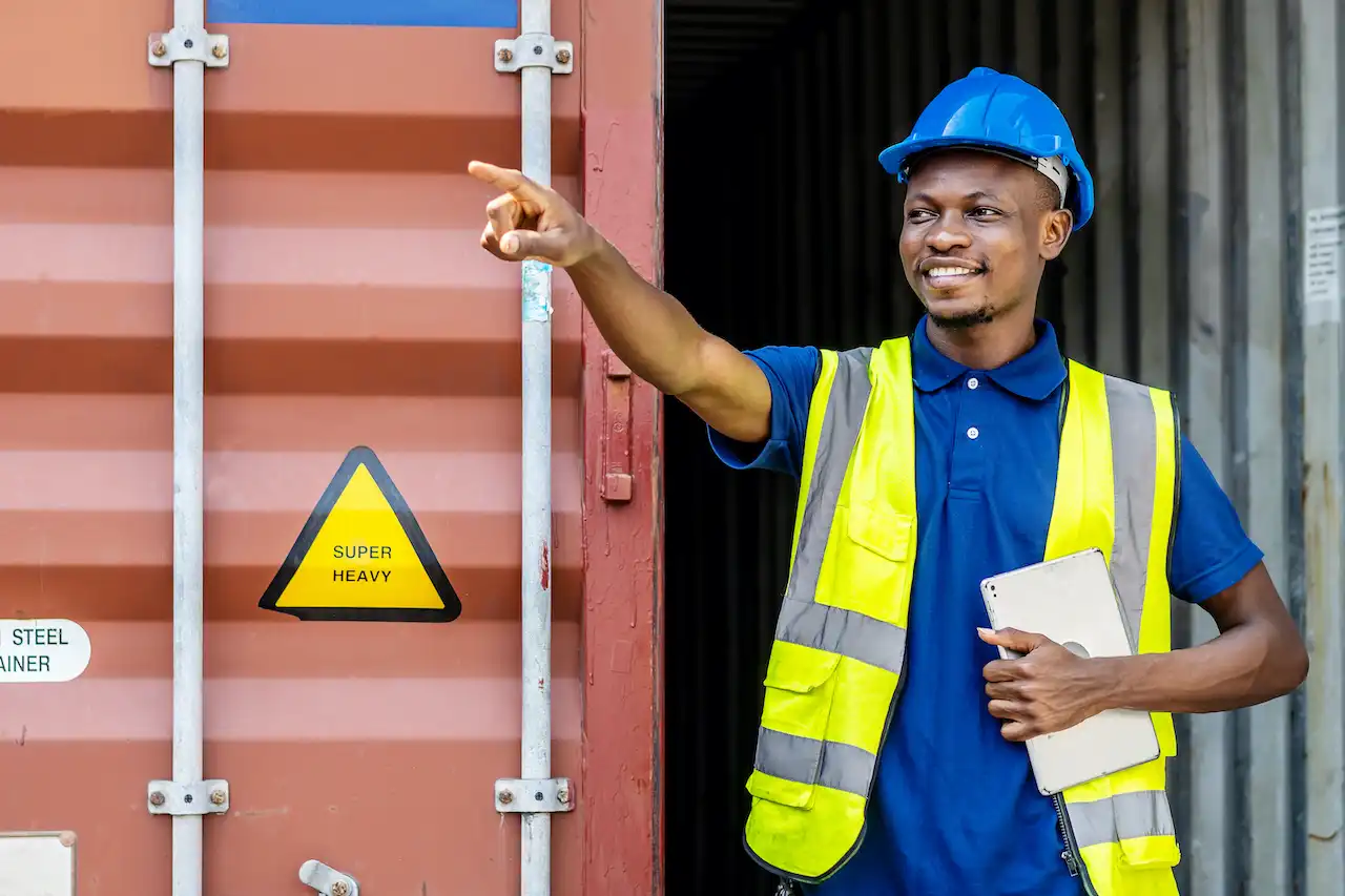 warehouse worker checks shipping container with di 2026 09 22 11 04 11 utc
